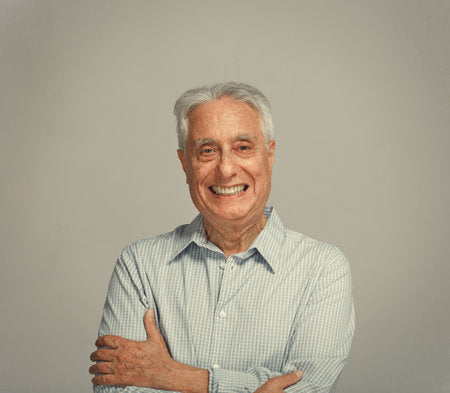 files/64123323-happy-smiling-senior-man-portrait-over-gray-background.jpg